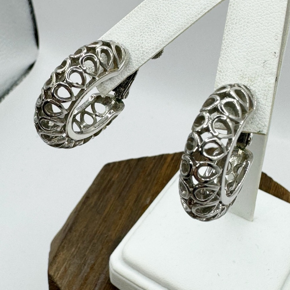 Vintage silver tone chunky hoop earrings with open cut outs hinged clip on